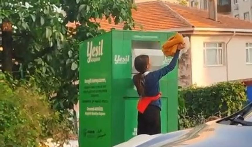 Canlarını hiçe sayarak giysi kumbarasından kıyafet çaldılar